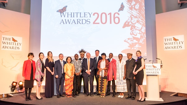 Left to right: Alison Rosser, Tracey Rennie-Starke, Danni Parks, Alexander Rukhaia, Hotlin Ompusunggu, Gilbert Adum, Karau Kuna, Sir David Attenborough, Edward Whitley, Farwiza Farhan, Makala Jasper, Juliette Velosoa, Muhammad Ali Nawaz, Rebecca Sennett